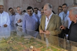 Mawlana Hazar Imam looks at a model of Humayun&#039;s Tomb and the surrounding area. The revitalisation of the gardens surrounding the tomb was completed in 2003 with the participation of the Aga Khan Trust for Culture. 