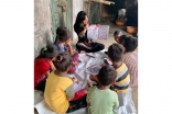 Soha begins the first day of class by familiarizing the children with fundamental English vocabulary words.