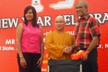 His Excellency Zainul Abidin Rasheed and Presidentbanoo Karam Bana present a wheelchair to a social welfare group representative. 