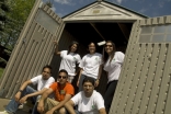 Edmonton youth pose outside one of the sheds they built in partnership with Habitat for Humanity. 