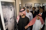 His Highness Sheikh Majid and Noor Ali Rashid  pause at a photograph of the late Ruler of Abu Dhabi, Sheikh Zayed Bin Sultan Al Nahyan.