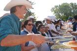 Prime Minister Justin Trudeau offers up pancakes to an excited crowd.