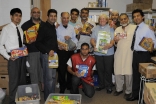 Volunteers from the Ismaili community and the Islamic Society of Toronto with Rev Helena-Rose Houldcroft, Director of the Flemingdon Park Ministry, at the food bank.