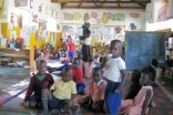 Children prepare for snack time at an AKF Madrasa Programme preschool in Uganda.