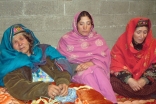 Women who survived the landslide rest in one of the schools that was re-purposed as a camp for internally displaced persons.