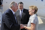 At his arrival in Toronto, Mawlana Hazar Imam is greeted by James Moore, the Federal Minister of Canadian Heritage, and Kathleen Wynne, Ontario’s Minister of Transportation.