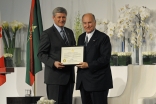 Mawlana Hazar Imam receives a certificate of Honorary Canadian Citizenship from Prime Minister Harper.