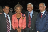 The three Ismailis who were recognised for their services as Canadian wardens in the DRC pose for a photograph with Governor General Michaëlle Jean. From the left: Altaf Sheriff, the Governor General, Sadrudin Nanji, Shiraj Hemraj.