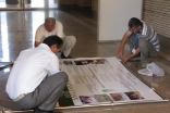 Volunteers hard at work setting up displays for the AKDN Exhibition at the Ismaili Centre, Dushanbe.