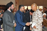 Professor Farid Esack is congratulated by ummah leaders during an event held in commemoration of Milad-un-Nabi at the Ismaili Centre, Burnaby.