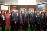 Jamati volunteers and representatives from AKF USA and FOCUS North America gather with Prince Hussain, Governor Schwarzenegger and his wife in front of the AKDN information booth at the Governors’ Global Climate Summit 3, which was hosted at the Universit