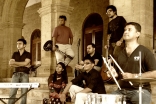 Members of the Salimahabad Orchestra. From left to right: Amirali Meghani, Naveed Rajput, Sadaf Faiz, Asif Noorani, Rahim Sundrani, Sohail Noorani, and Rafiq Vadivala.