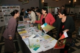 Nafisa Gulshaeva, a staff member of the AKF-supported Institute of Professional Development in Dushanbe, discusses teaching resources with visitors.  