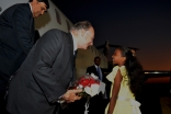 Mawlana Hazar Imam is presented with a bouquet of flowers upon his arrival at Julius Nyerere International Airport in Dar es Salaam.