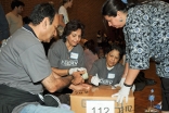 Ismaili volunteers taking part in the USA Jamat’s I-CERV programme pack clothes for Ocean Park Community Center in California.