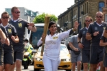 Zahra Jessa runs as a torch bearer in the 2012 London Olympics on 25 July.