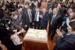 Princess Zahra with the Vice Speaker of the Kyrgyz Parliament, Asiya Sasykbaeva, and a student of the Aga Khan School in Osh cutting a 10th Anniversary cake for the school in the presence of Kyrgyz government and Osh civic officials.