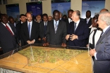 Mawlana Hazar Imam, Prime Minister Odinga, Prince Hussain, and other dignitaries discuss the model of the soon to be restored Nairobi City Park.