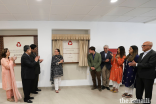 Princess Zahra and her son Iliyan reveal a plaque to commemorate the official opening of the Aga Khan Health Centre in Aliabad.