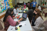 Volunteers collect data from members of the Jamat at the vaccination centre.