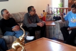 Ismaili Council for Canada President Malik Talib, Honorary Secretary Arif Amlani
and President Mohamud Zaver of the Ismaili Council for the Praries visit with a host family and their guest, who was evacuated from a flooded Calgary neighbourhood.