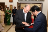 President Ajanee presents Mawlana Hazar Imam with a 19th century Indian dervish staff with a handle formed in the calligraphic name of Ali, and inscriptions that read “Ya Ali Madad” and “Huwa Ya Ali Madad”. The gift was presented a