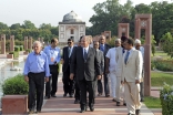 Mawlana Hazar Imam, accompanied by Prince Hussain and officials from the Aga Khan Trust for Culture, walks down the central axis of the Sunder Nursery — once known as Azim Bagh (great garden) — after visiting  the Sunder Burj, a 16th century tomb restored