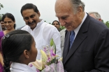 A young girl presents Mawlana Hazar Imam with flowers on the occasion of the inauguration of the Aga Khan Academy, Hyderabad.