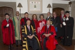 Members of the procession pose for a group photo ahead of the convocation ceremony at Trinity College.