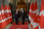 Mawlana Hazar Imam and Prime Minister Stephen Harper walk the Hall of Honour at the Parliament of Canada.