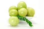 Amla (Indian gooseberry) is a tangy seasonal fruit that is high in vitamin C.