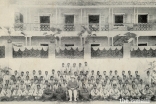 Mawlana Sultan Mahomed Shah in his IVC Colonel uniform surrounded by members of the IVC in India.