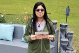 Vaneeza Rupani holds a photo of Ingenuity, the NASA Mars helicopter she named.