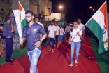 Athletes bearing the Indian flag follow the Jubilee Games Fanous at a ceremony in Mumbai. Shams Maredia