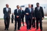 Ismaili Council President Minaz Jamal and AKDN Representative Mahmood Ahmed accompany Mawlana Hazar Imam and Minister Tumwesigye Elioda from the plane. AKDN / Will Boase