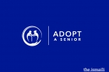 The logo designed for the Adopt a Senior initiative depicts a carer helping a senior citizen, housed inside a bubble of safety. 