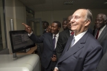 Mawlana Hazar Imam watches as the newly commissioned Nation Media printing press commences operation. Aziz Islamshah