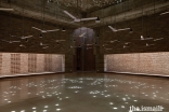 The Bait Ur Rouf Mosque in Dhaka, Bangladesh. Random circular roof openings allow daylight into the prayer hall creating an ornate pattern on the floor, enhancing spirituality through light.