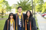 Alma, Aqil, and Anusha Merchant pose for a sibling photo at their high school graduation.