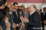 Mawlana Hazar Imam shares a light moment with Jamati leaders upon arrival in Vancouver.