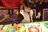 A young boy colors in the Early Childhood section of the Reflections Lounge on July 11, 2017.