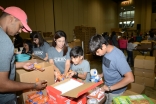 Younger members of the Jamat assisting in the HOPE for Puerto Rico event at the Orlando Convention Center.