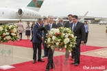 Mawlana Hazar Imam waves goodbye to the Jamati leadership as he leaves the airport. 