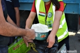 Aga Khan Agency for Habitat volunteers take part in ongoing food distribution activities in Roshtqala, Gorno-Badakhshan.