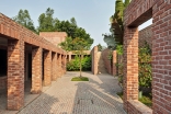 The inspiration for the Friendship Centre came from the Buddhist monasteries in the area, and the architectural influences include exposed brickwork, stark character, and a quadrilateral layout.