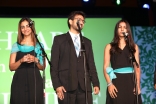 Aiyla Ladha (right) singing with the choir.