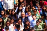 His Excellency Marcelo Rebelo de Sousa, President of the Portuguese Republic, surrounded by young Ismailis in the Garden of Fruits at the Ismaili Centre Lisbon.