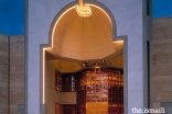 The principal entrance of the Ismaili Centre, Vancouver, takes the form of a niche, emanating a lamp-like light.