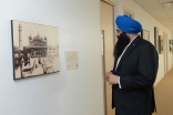 Federal multiculturalism minister Tim Uppal examines a photograph from the Faith &amp; Places exhibition at the Ismaili Centre, Toronto. Akbar Dewji