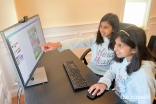 Simal and Sophia Ali creating a flyer in Canva.